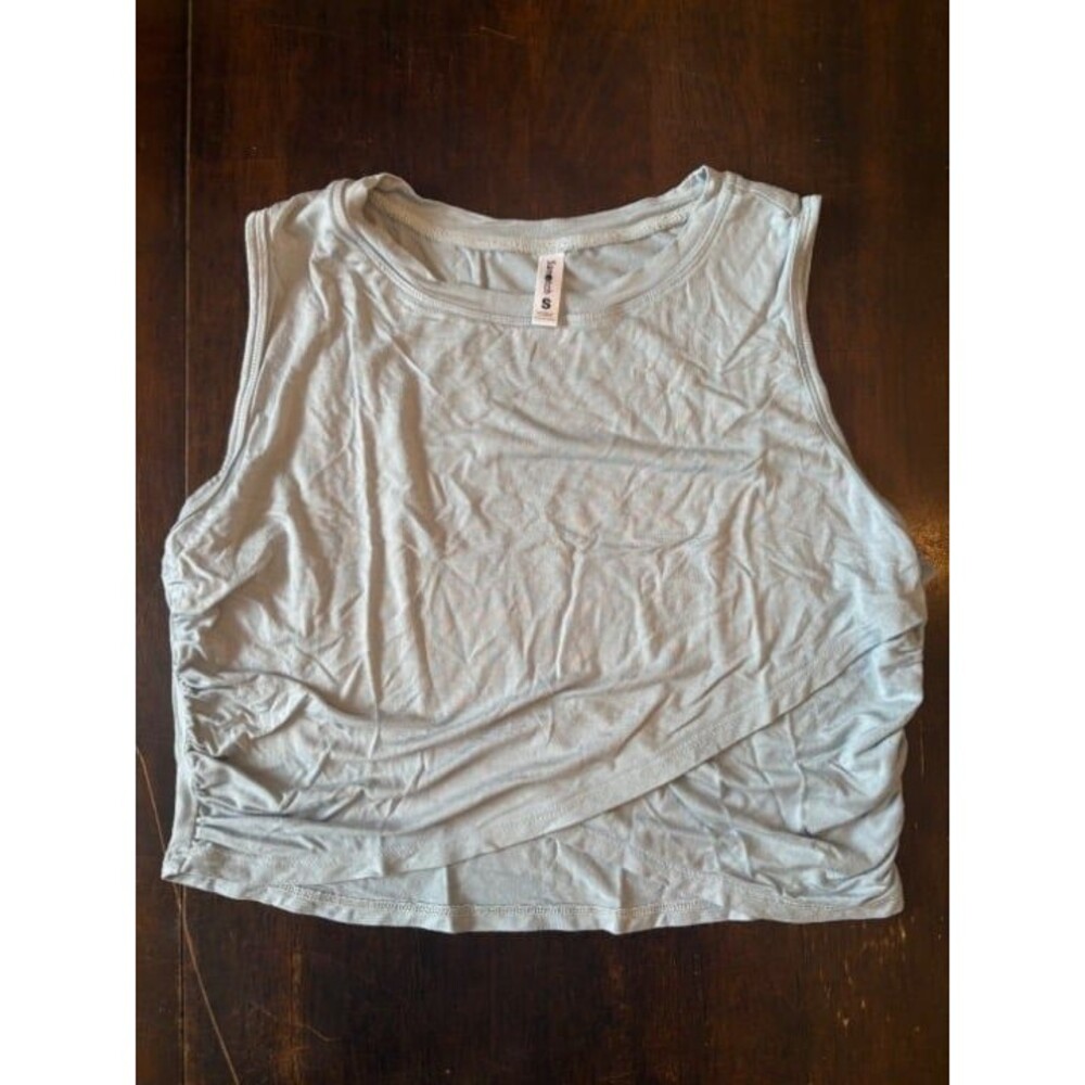 Light blue athletic crop top with faux wrap design lightweight wide strap